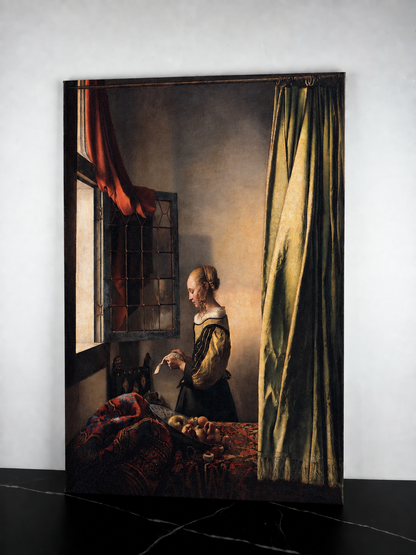 Jeune femme lisant une lettre à la fenêtre – Johannes Vermeer